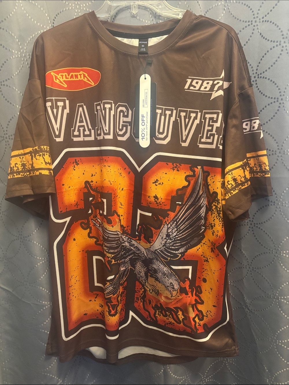 Vintage Vancouver 1987 Brown Graphic Jersey with Orange Accents